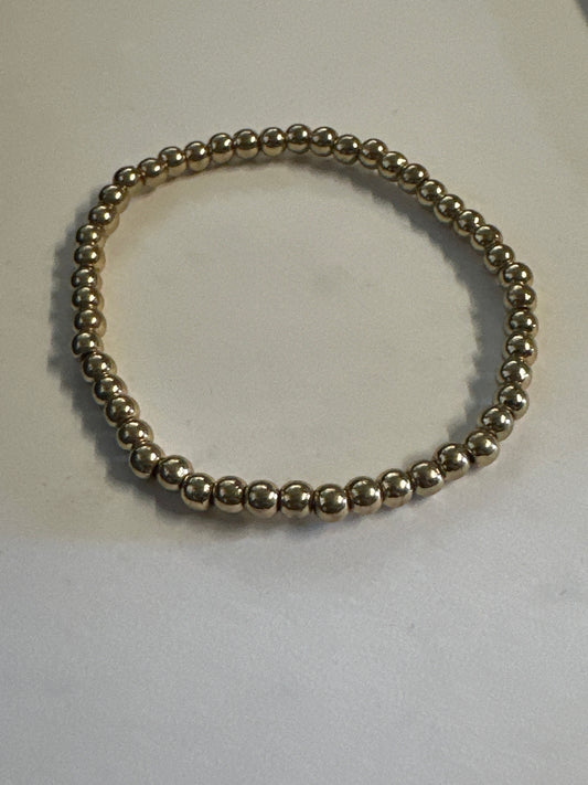 PARKS AND RECREATION: Leslie Knope HERO gold bead Bracelet