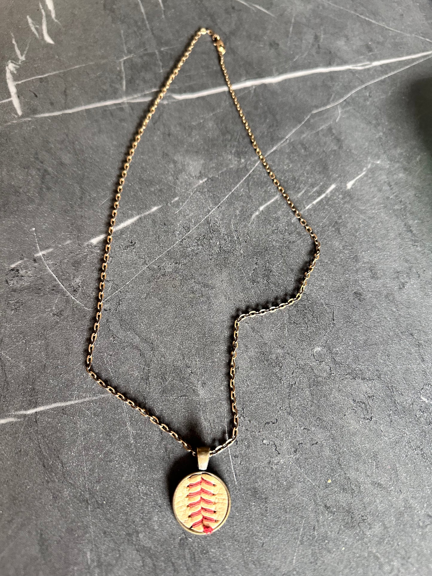 BALLERS: Spencer Strassmore’s (Dwayne Johnson) HERO Baseball Charm Necklace