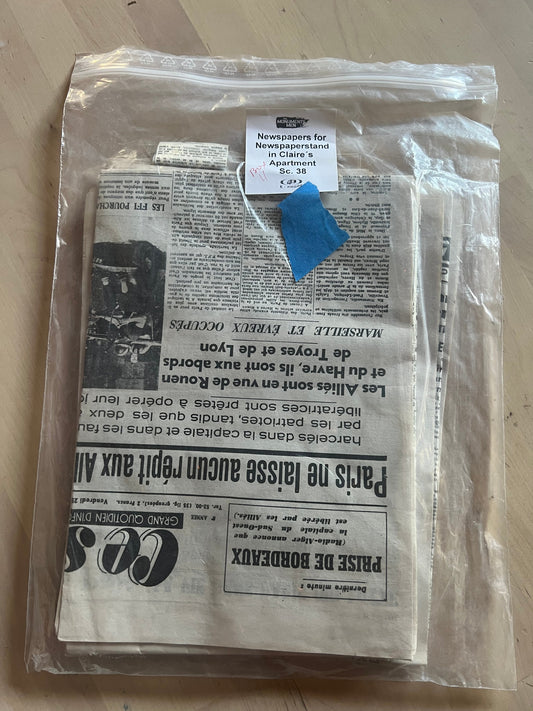 Monuments Men: Claire's Newspaper in apartment
