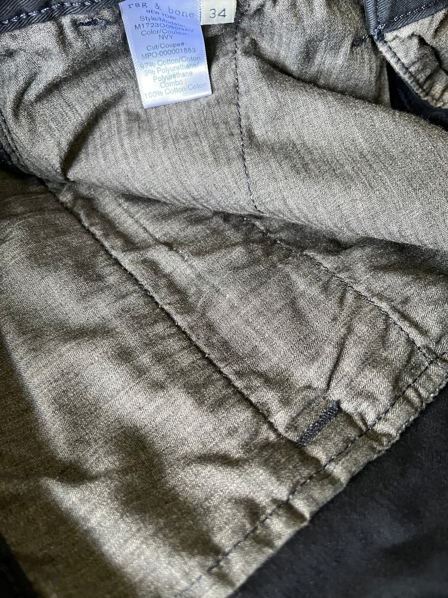 WRATH OF MAN: “H” HERO WARDROBE | ACADEMY M.T.O.  Beige Cotton And Harrington Lining Custom Made Coat, G-Shock Watch, Rag and Bone Blue Pants, Brown socks and SUNSPEL WHITE T-Shirt